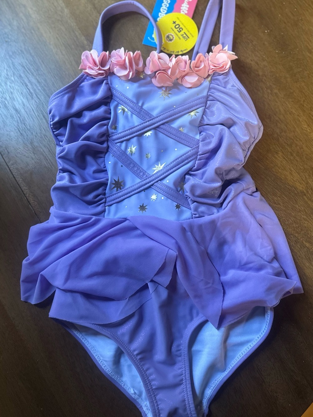 Ruffle Butts Lavender One-Piece with Pink Floral Trim and Gold Stars
